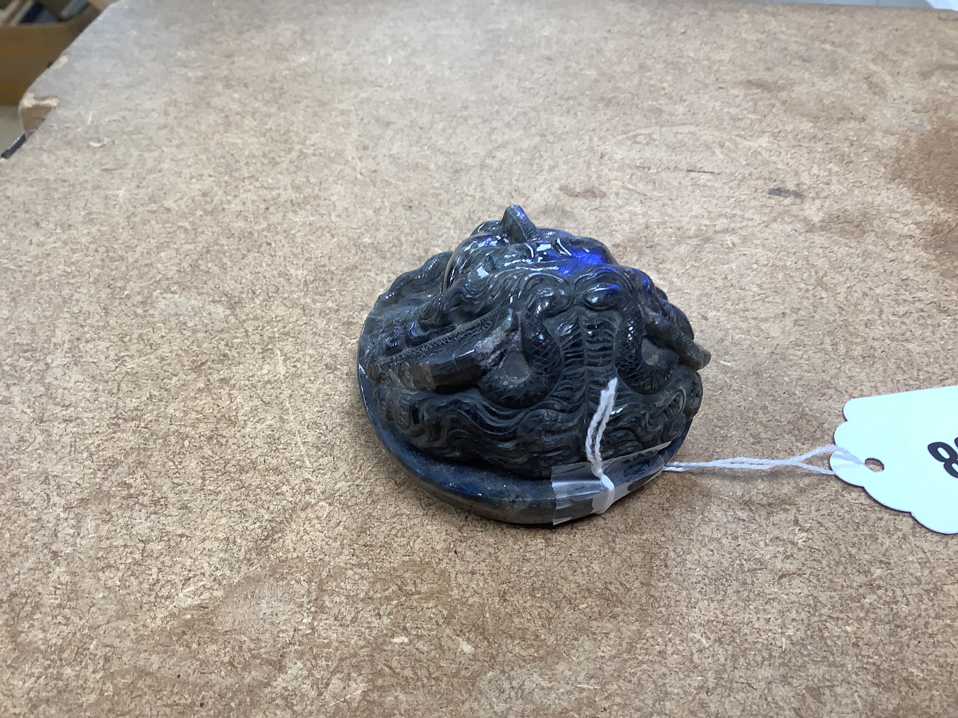 A carved labradorite paperweight with the head of Medusa, After the Antique, 8cm